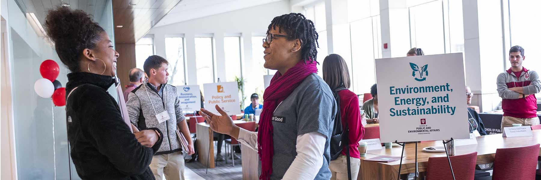 Two students enjoy a discussion.